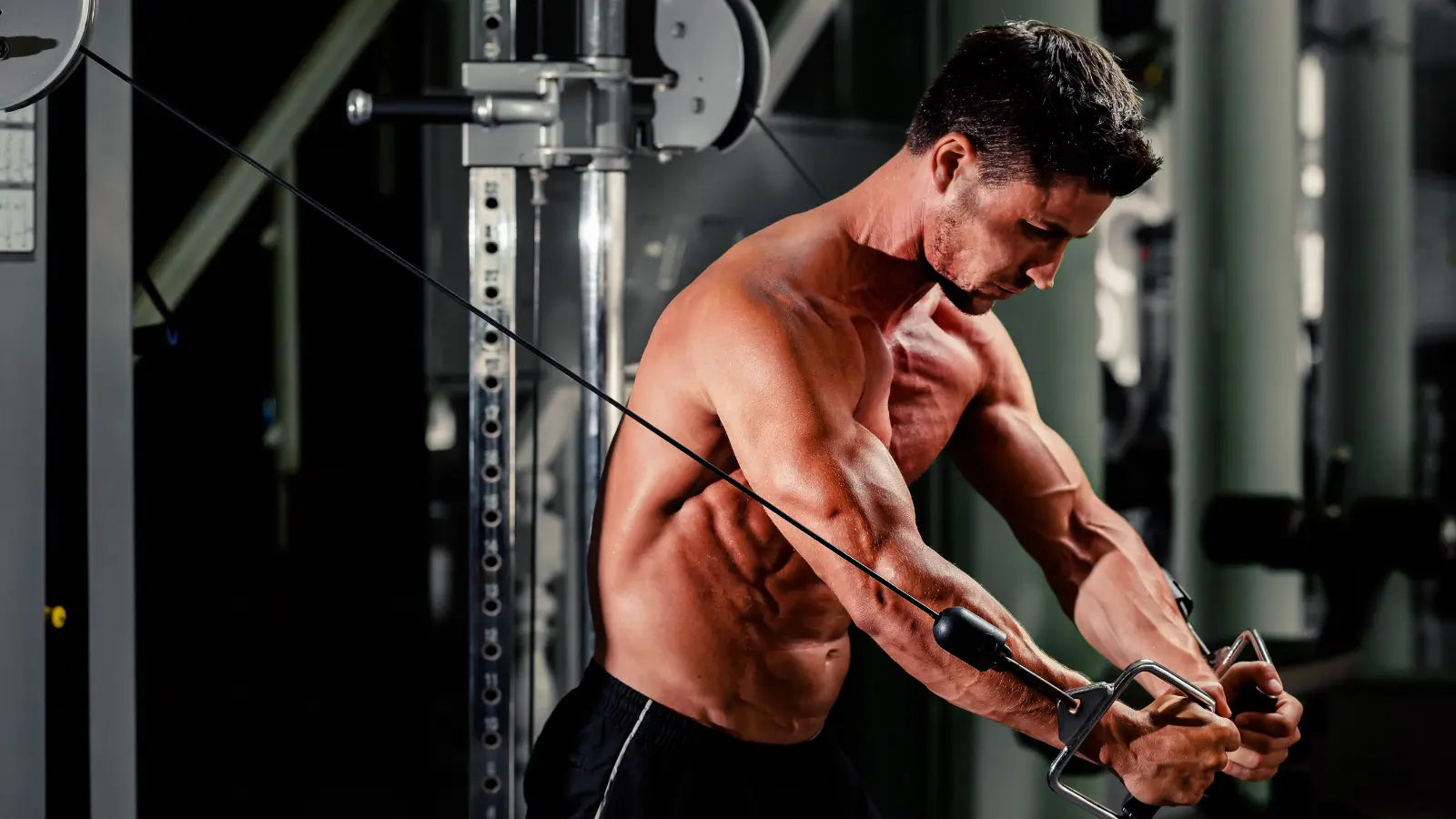 Male using cables to exercise