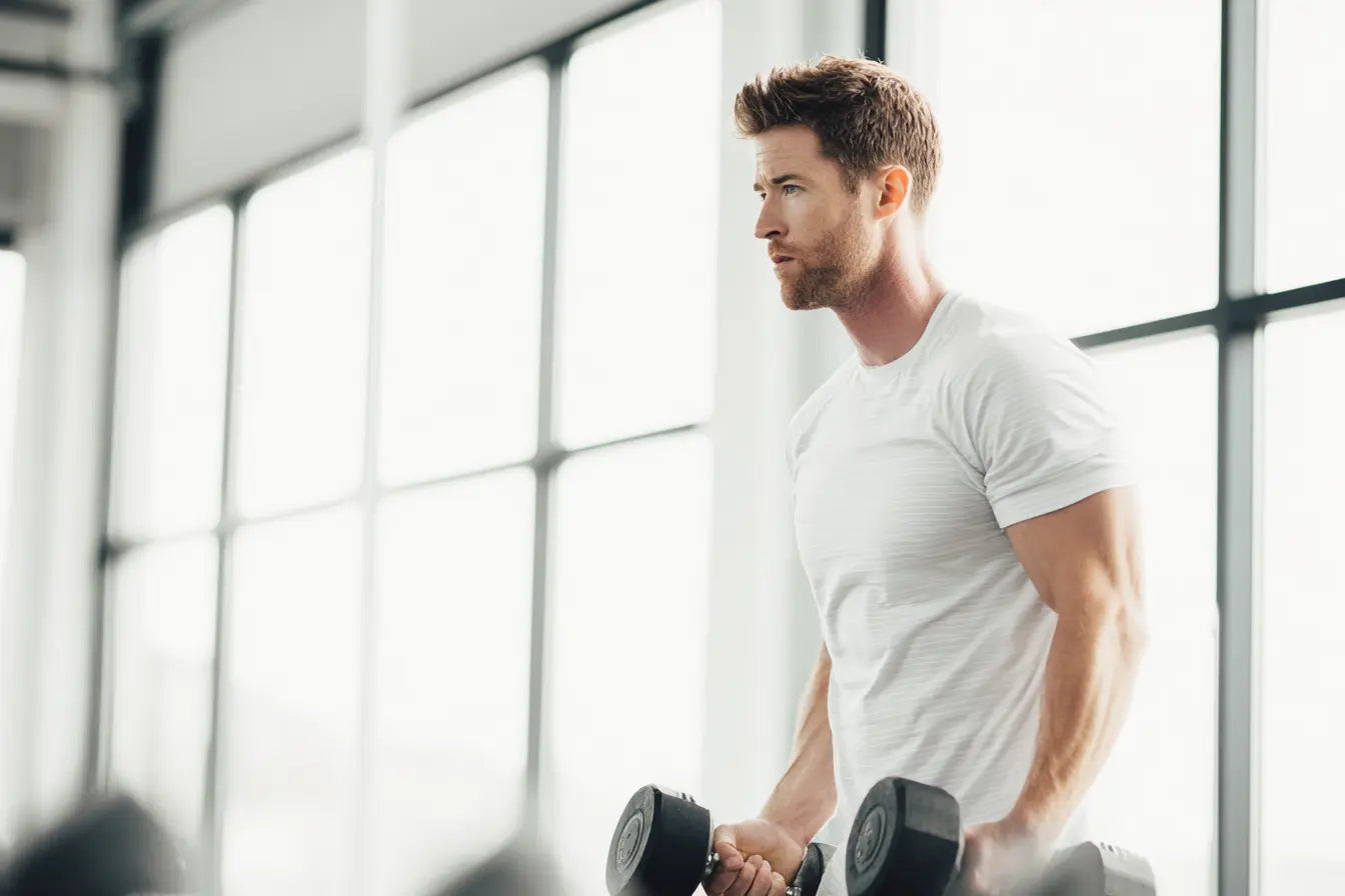 Male lifting dumbbells